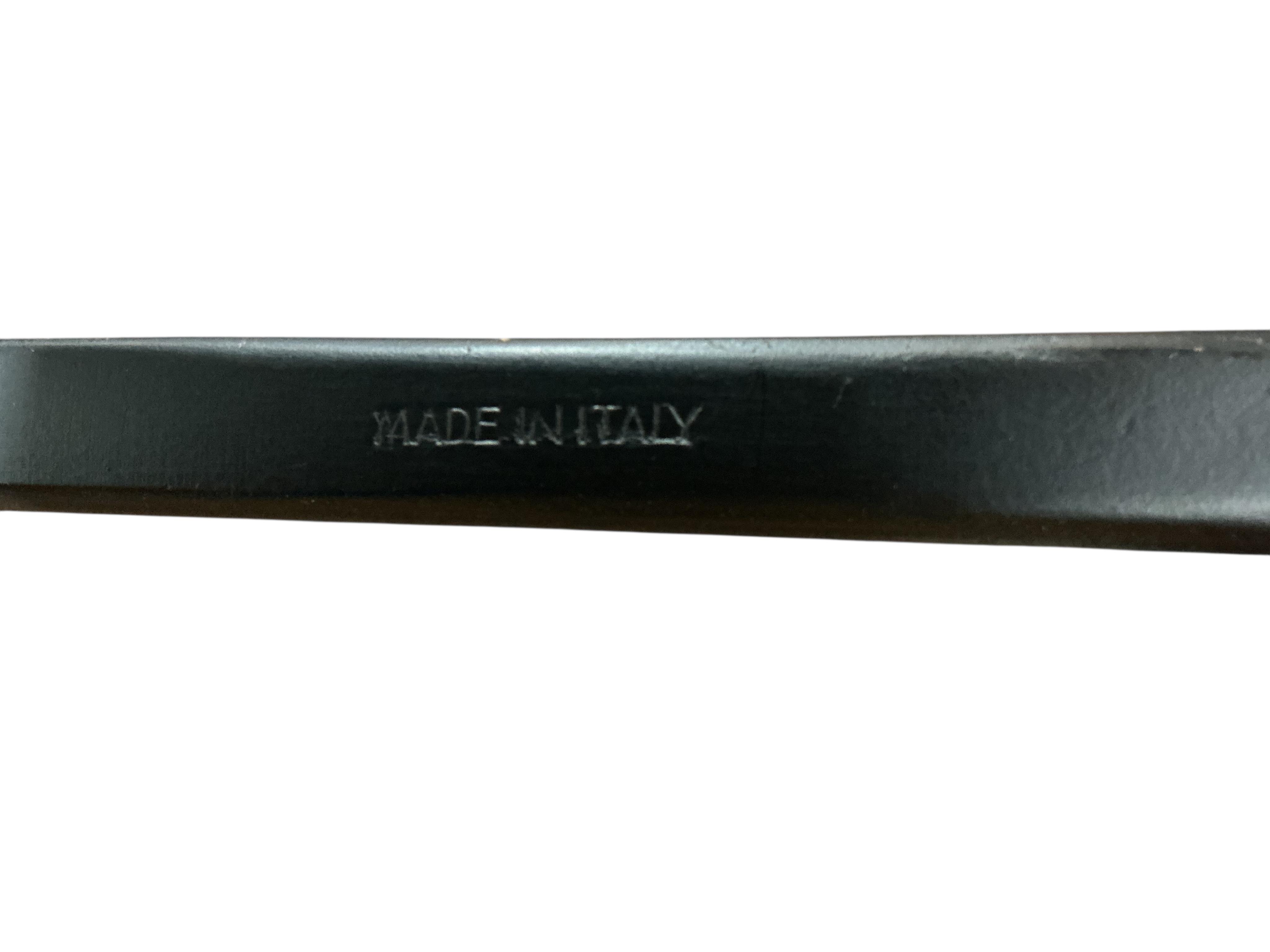 A set of four Gio Ponti ebonised ladderback rush seat dining chairs, width 40cm, depth 41cm, height 107cm